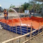 Foto : Pendistribusian bantuan air bersih dari BPBD dan menggandeng pihak lain (Sumber : Dokumentasi BPND Pati)